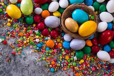 Delicious chocolate easter eggs ,bunny and sweets on dark background Stock Photos