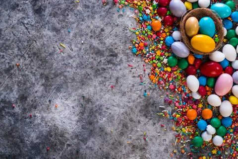 Delicious chocolate easter eggs ,bunny and sweets on dark background Stock Photos