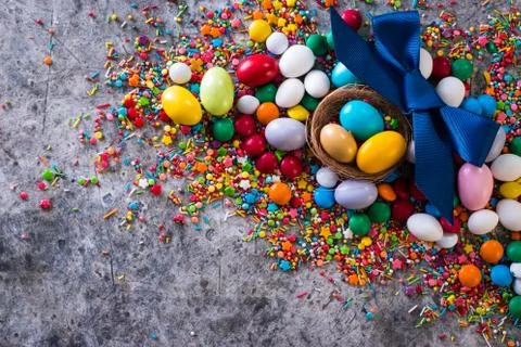 Delicious chocolate easter eggs ,bunny and sweets on dark background Stock Photos