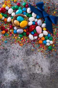 Delicious chocolate easter eggs ,bunny and sweets on dark background Stock Photos