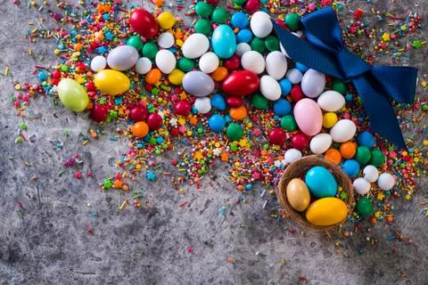 Delicious chocolate easter eggs ,bunny and sweets on dark background Stock Photos