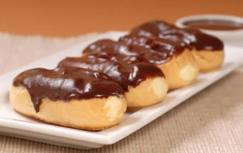 Delicious chocolate eclairs Stock Photos