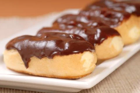 Delicious chocolate eclairs Stock Photos