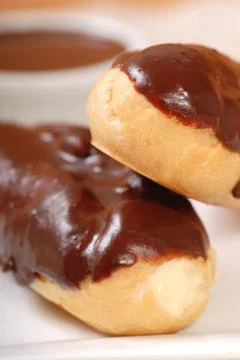 Delicious chocolate eclairs Stock Photos