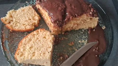 Delicious chocolate sponge cake slices on a crystal serving platter video Stock Footage 339247395