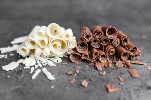 Delicious chocolate swilrs on rustic background Stock Photos