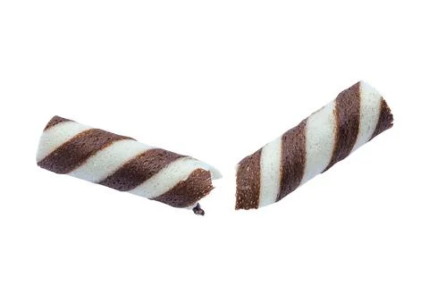 Delicious chocolate wafer roll  falling on white background with clipping path. Stock Photos
