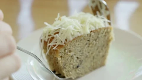 Delicious coconut cake slice cozy kitchen food home environment close-up Stock Footage 302970462