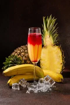 Delicious cold refreshing ananas smoothie drink with banana and redcurrant se Stock Photos