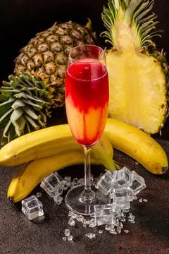 Delicious cold refreshing ananas smoothie drink with banana and redcurrant se Stock Photos