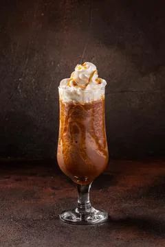Delicious cold refreshing ice coffee in cocktail glass Stock Photos