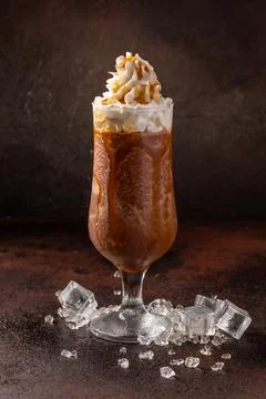 Delicious cold refreshing ice coffee in cocktail glass Stock Photos
