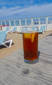 Delicious cool ice tea without a brand with a lemon and ice cube Stock Photos