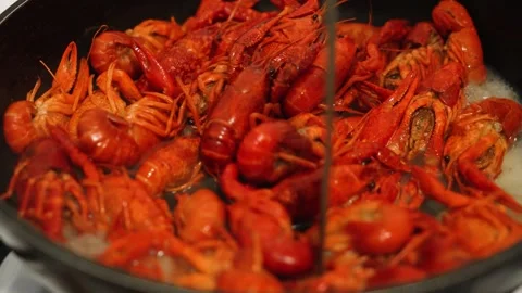 Delicious Crayfish Frying in Pan, Showcasing Traditional Delicacy Preparation Stock Footage 303490946