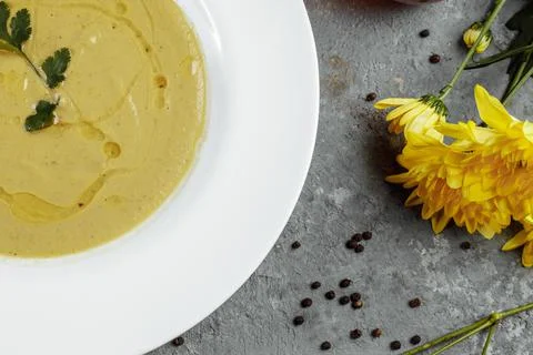 Delicious cream soup with bread on the table Stock Photos