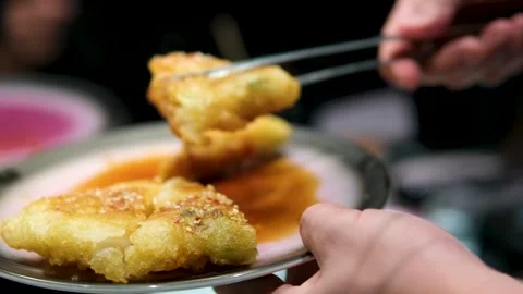 Delicious Crispy Chicken Nuggets Cooking in Oil - Close-Up Slow Motion Footage Stock Footage 301313637