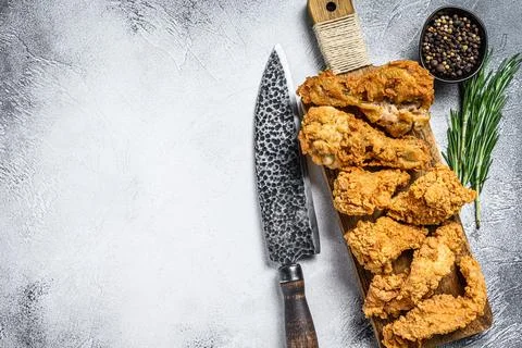 Delicious crispy fried breaded chicken parts. White background. Top view. Copy Stock Photos