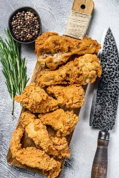 Delicious crispy fried breaded chicken parts. White background. Top view Stock Photos