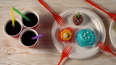 Delicious cupcakes with drinks. Stock Footage 74272832