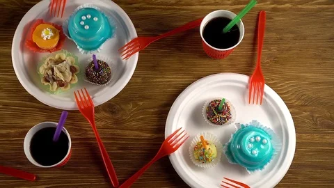Delicious cupcakes with drinks. Stock Footage 74273844