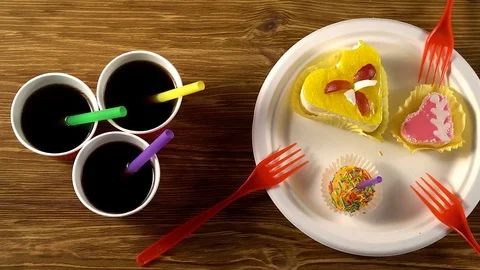 Delicious cupcakes with drinks. Stock Footage 74350466