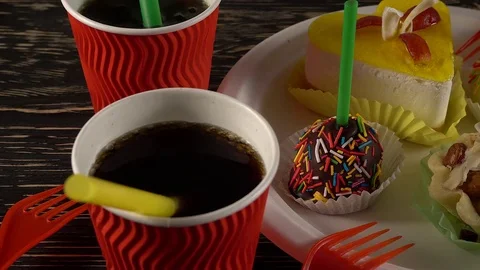 Delicious cupcakes with drinks. Stock Footage 74482502