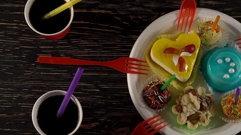 Delicious cupcakes with drinks. Stock Footage 74721576