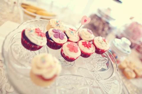 Delicious cupcakes on table Stock Photos