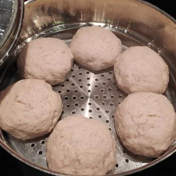 Delicious cutlets are cooked in a double boiler. Stock Photos