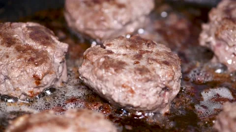 Delicious cutlets are fried in a pan, close-up Stock Footage 134455431