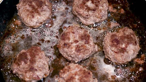Delicious cutlets are fried in a pan, the view from the top Stock Footage 134505039