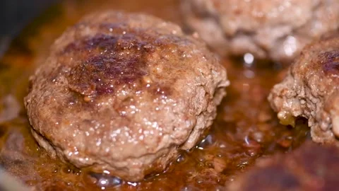 Delicious cutlets are fried in a pan, close-up Stock Footage 134594446
