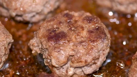 Delicious cutlets are fried in a pan, close-up Stock Footage 134595062