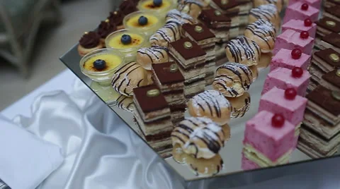 Delicious decorated candy bar, sweets on tables for wedding reception Stock Footage 66443261