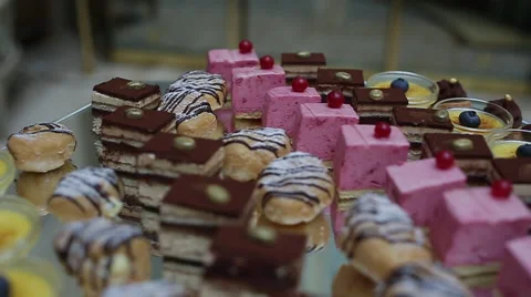 Delicious decorated candy bar, sweets on tables for wedding reception Video stock 66443292