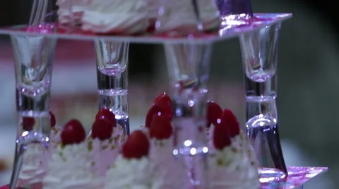 Delicious decorated candy bar, sweets on tables for wedding reception Video stock 66443363