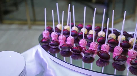 Delicious decorated candy bar, sweets on tables for wedding reception Video stock 66443427