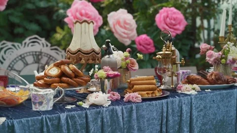 Delicious decorated sweets on buffet table, party catering in garden Stock Footage 196218051