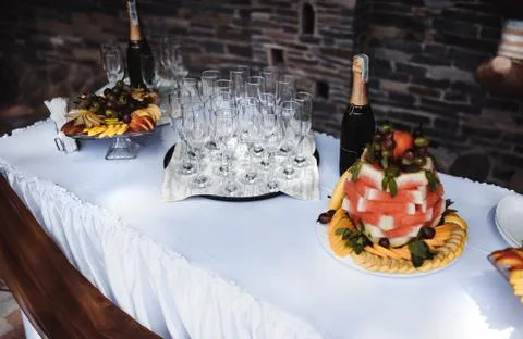 Delicious decorated sweets on white table, cocktails party catering Stock Photos