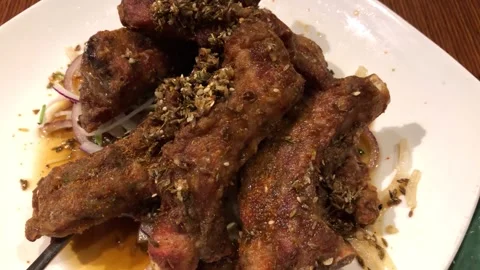 Delicious deep fried spiced pork ribs served in a Chinese restaurant. Stock Footage 326083969