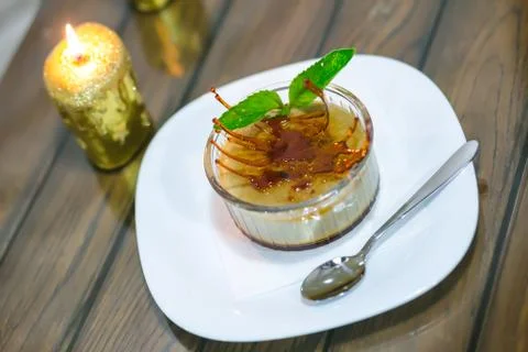 Delicious dessert on the plate with mint leaf Stock Photos