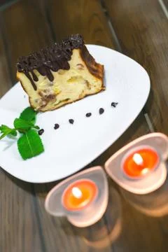 Delicious dessert on the plate with mint leaf Stock Photos