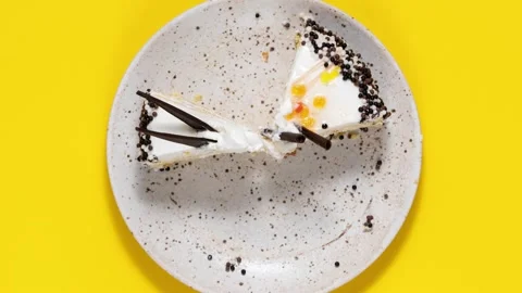A delicious dessert served on a simple, bright yellow plate. Stop motion Stock Footage 337761378