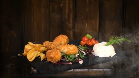 Delicious dinner with Chicken wings, chips and rice Stock Footage 104667120