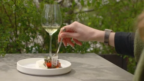 A delicious dish on a white elegant plate on the terrace of the restaurant. Stock Footage 277134953