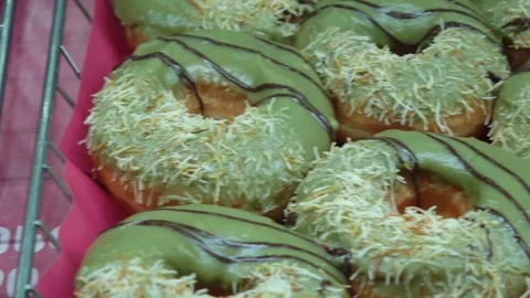 Delicious display of muffins, donuts, and pastries in baskets Stockbeeldmateriaal 308035981