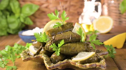 Delicious dolma stuffed grape leaves rice, white yogurt sauce. Lebanese dolma Stock Footage 196809499
