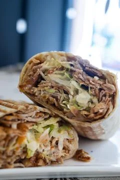 Delicious doner kebab wrap fast food meal cut in half Stock Photos