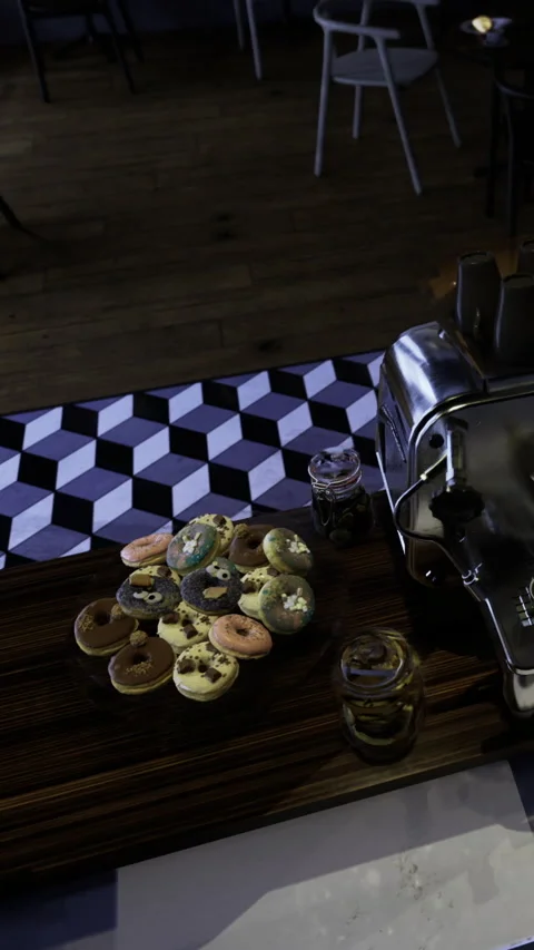 Delicious donuts and coffee machine on wooden table in cafe setting Stock Footage 331634216
