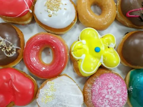 Delicious donuts covered with multi-colored glaze. Stock Photos